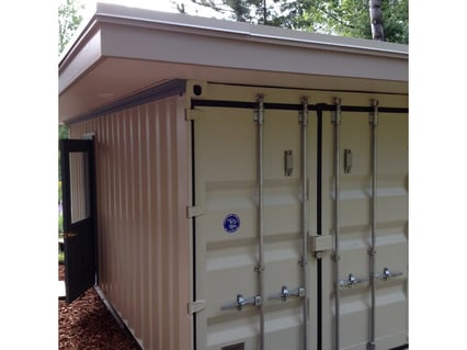 Container shed with roof and man-door