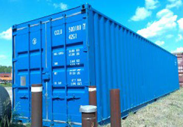 bright blue shipping container with blue sky background