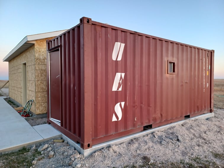 Tornado Shelter Container with door that swings inside and opening on the side to check the weather_ Before it is anchored to the ground