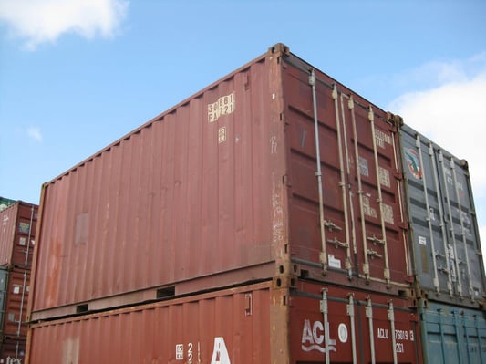 stacked red shipping containers