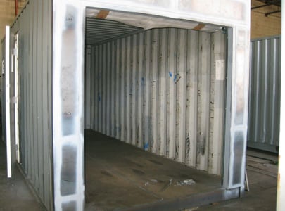 Used container prepped for roll-up door