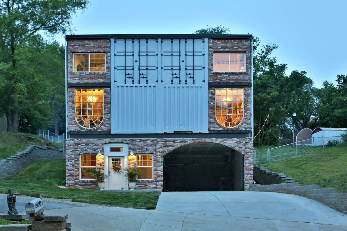 house made from shipping containers with brick added