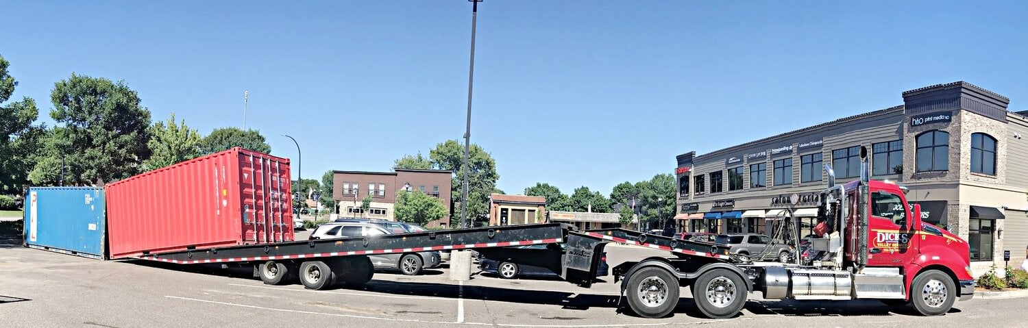 shipping container be unloaded from a flatbed