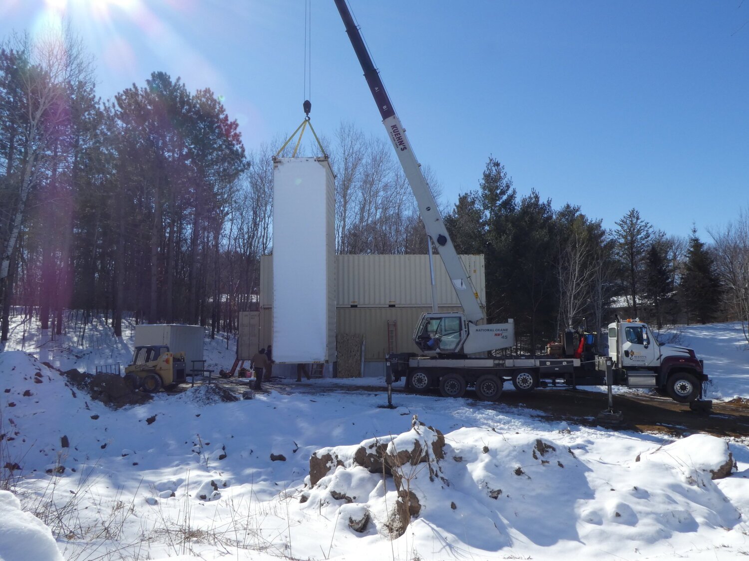 container being placed by crane