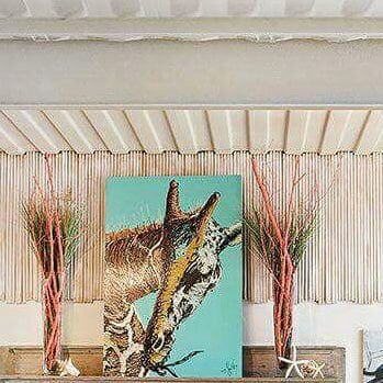 a picture of a giraffe inside a container home