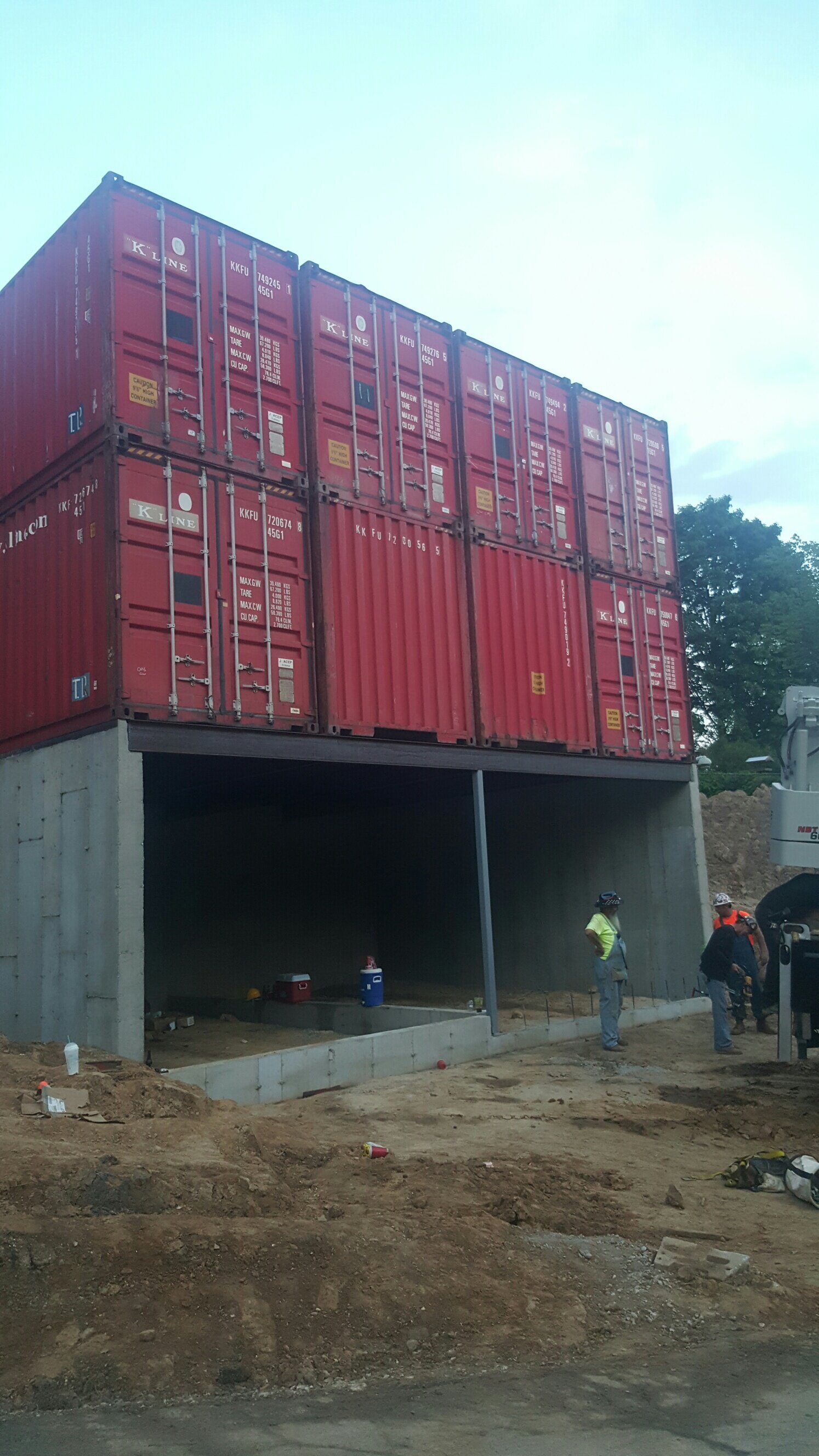 a container home being placed and configured