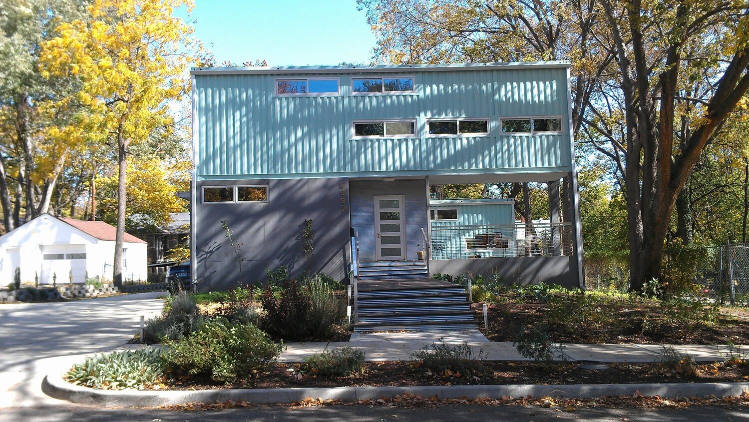 a container home painted light blue