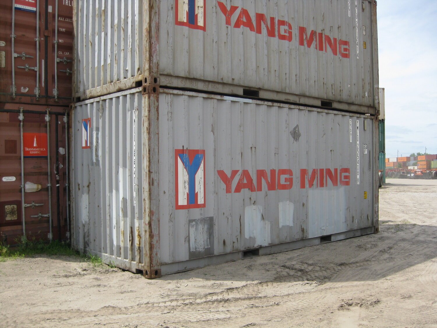 two old and used looking gray containers