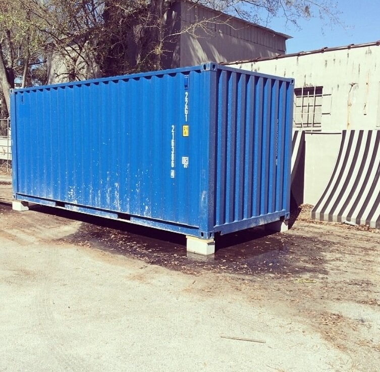 an old blue shipping container