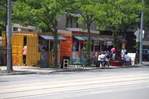 many containers lining a street