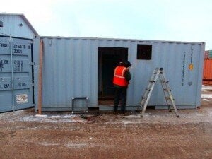 a container being fitted for a door