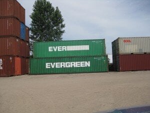 two stacked green containers