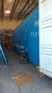 an old blue shipping container