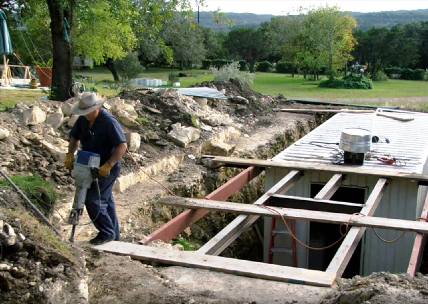 shipping container being buried as a shelter