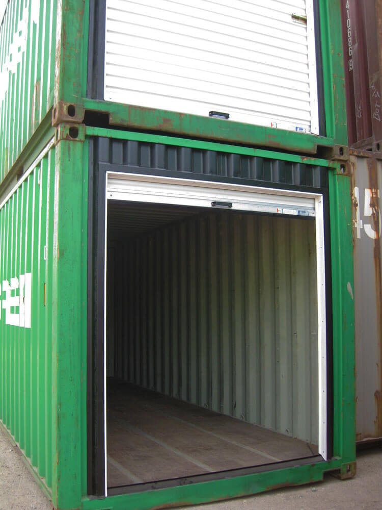 a large door added to a green shipping container