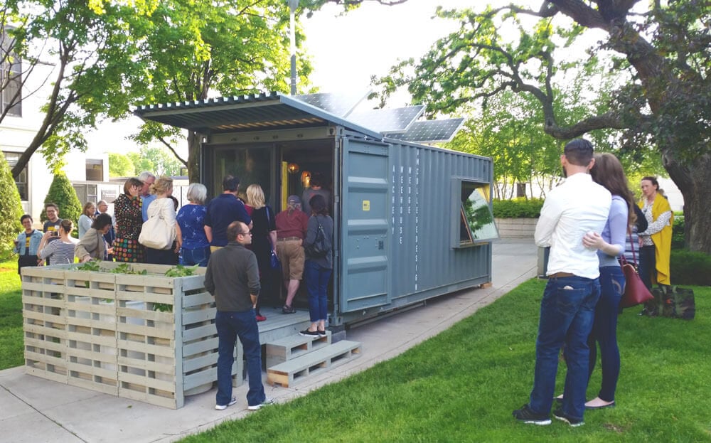 a container with and end open and has been converted to a hotel room