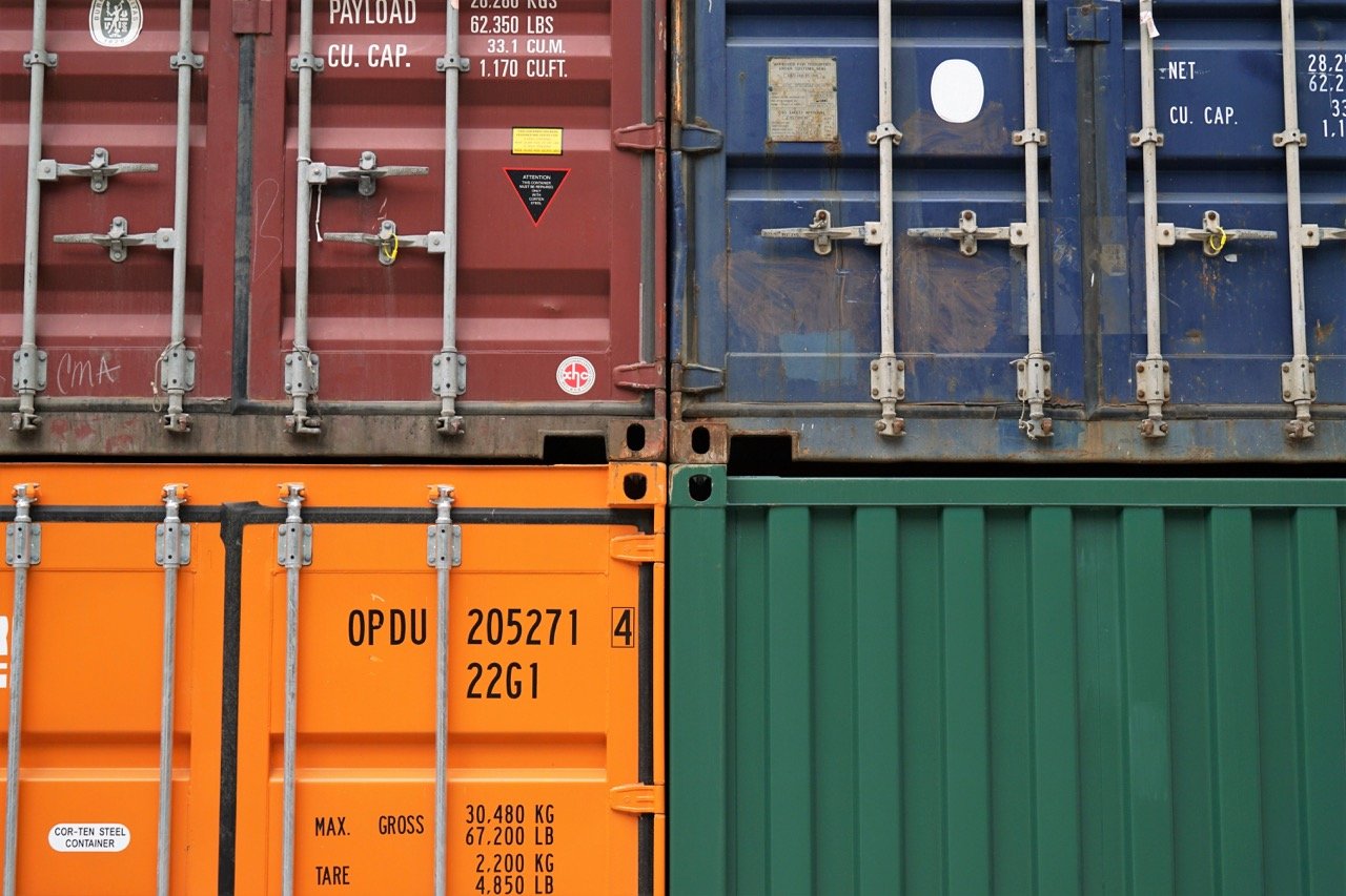 stacked shipping containers in various colors