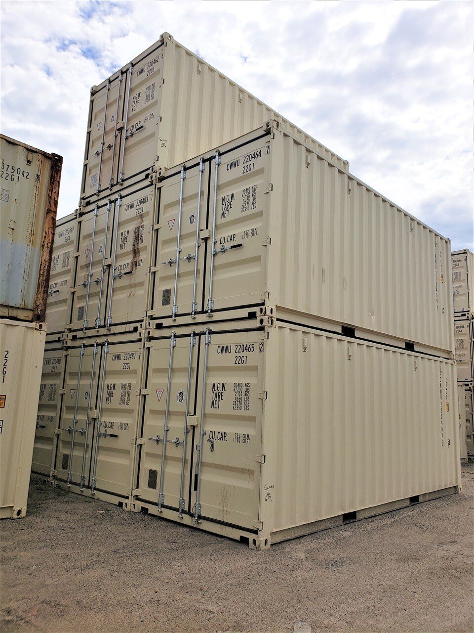 stacked, tan colored shipping containers 